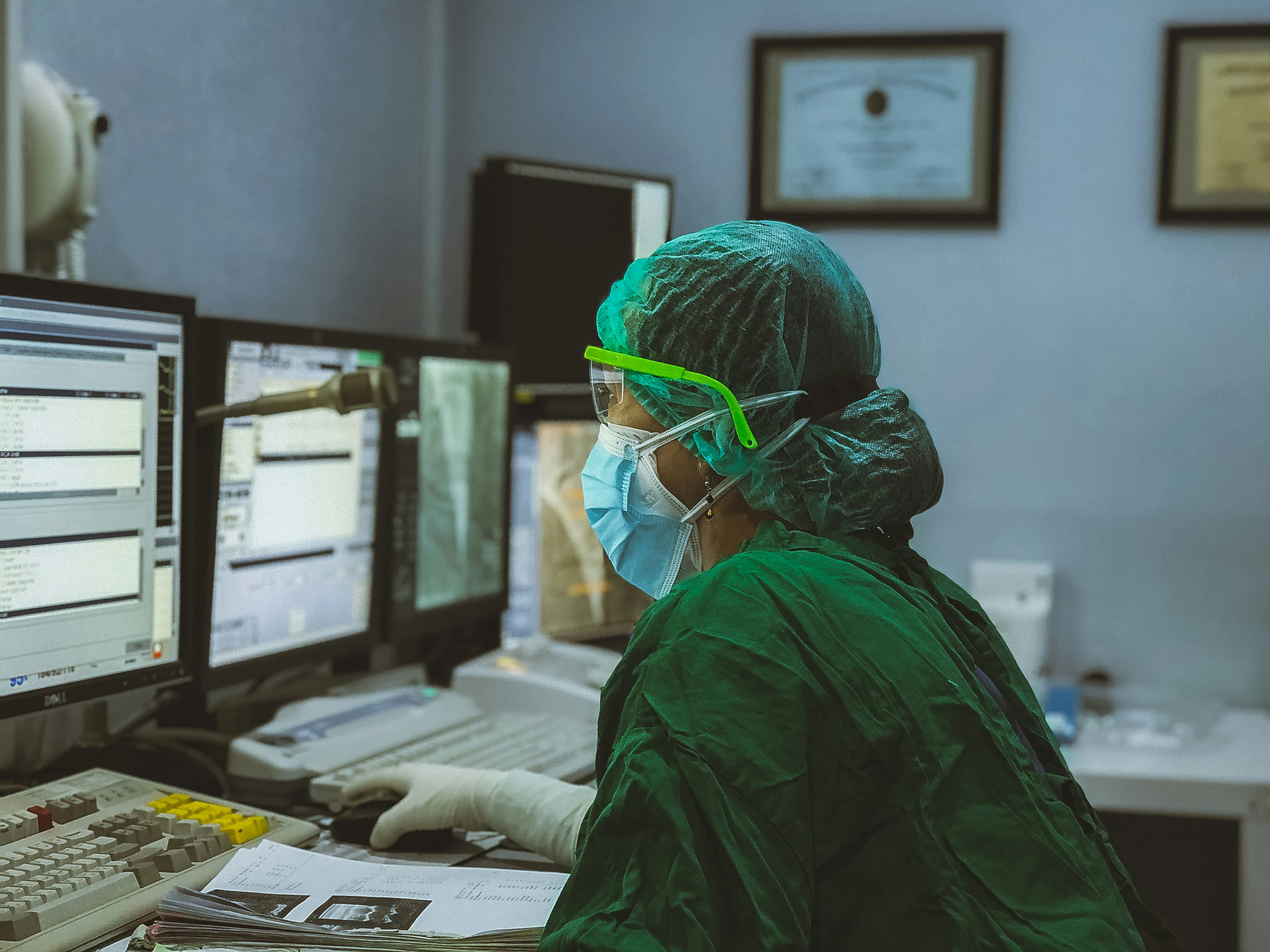 Modern clinical environment with robotic surgical arm and healthcare professional